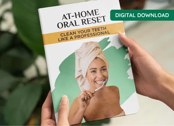 ProDentim bonus e-guide At-Home Oral Reset, held in two hands